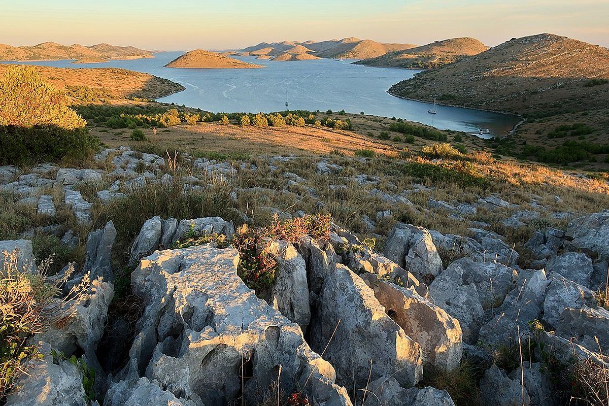 A view of the many Kornati islands seen from a rocky hill just before dusk