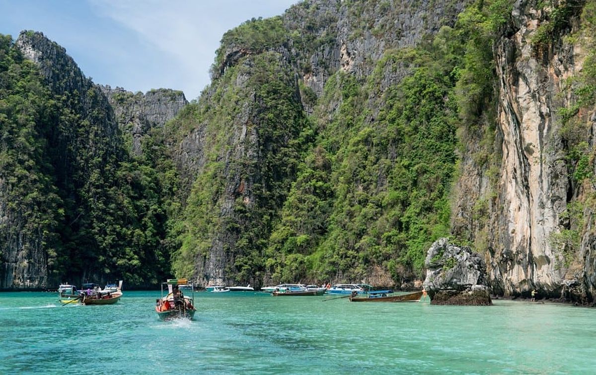 Boats in the turquoise water on Phi Phi Island, Thailand.