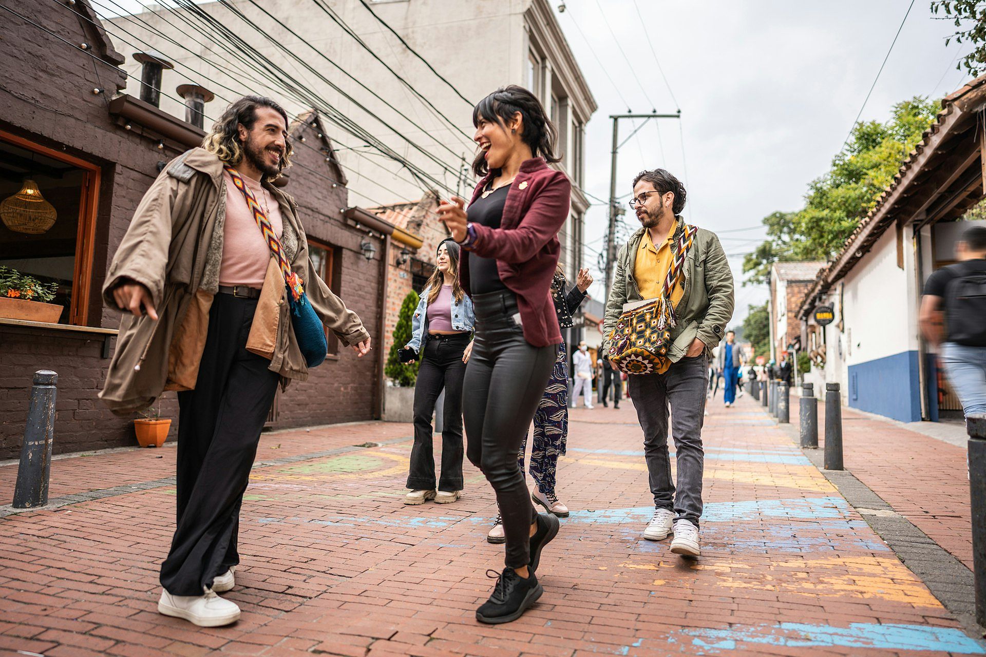 Friends dancing in the street in Bogotá