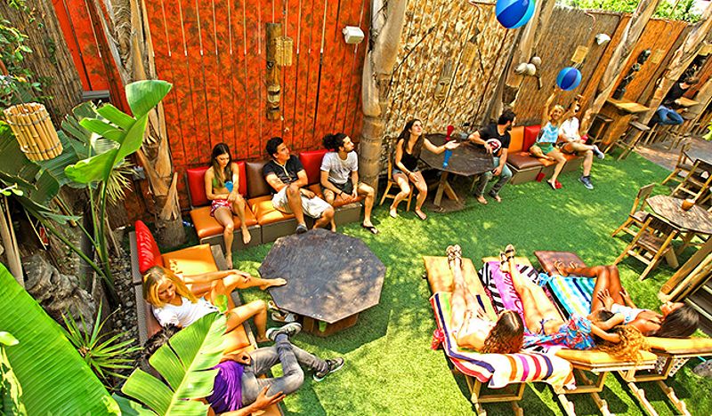 Guests socializing in the courtyard of Banana Bungalow Hollywood