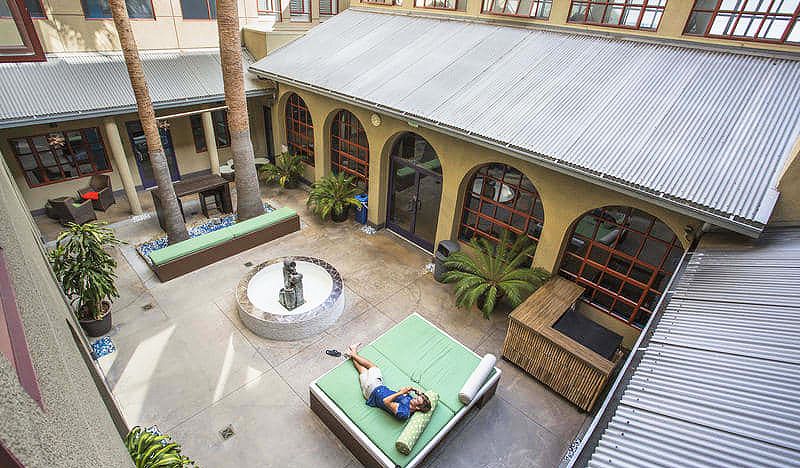 Inner courtyard with outdoor couches at HI Los Angeles Santa Monica