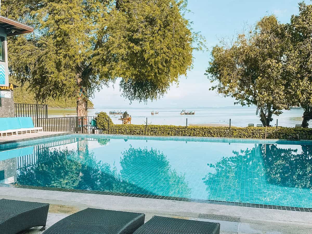 The outdoor pool at Ibiza Pool Party Hostel in Koh Phi Phi with great ocean views.